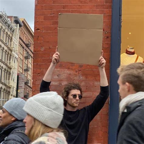 Free man-holding-carboard.jpg meme template